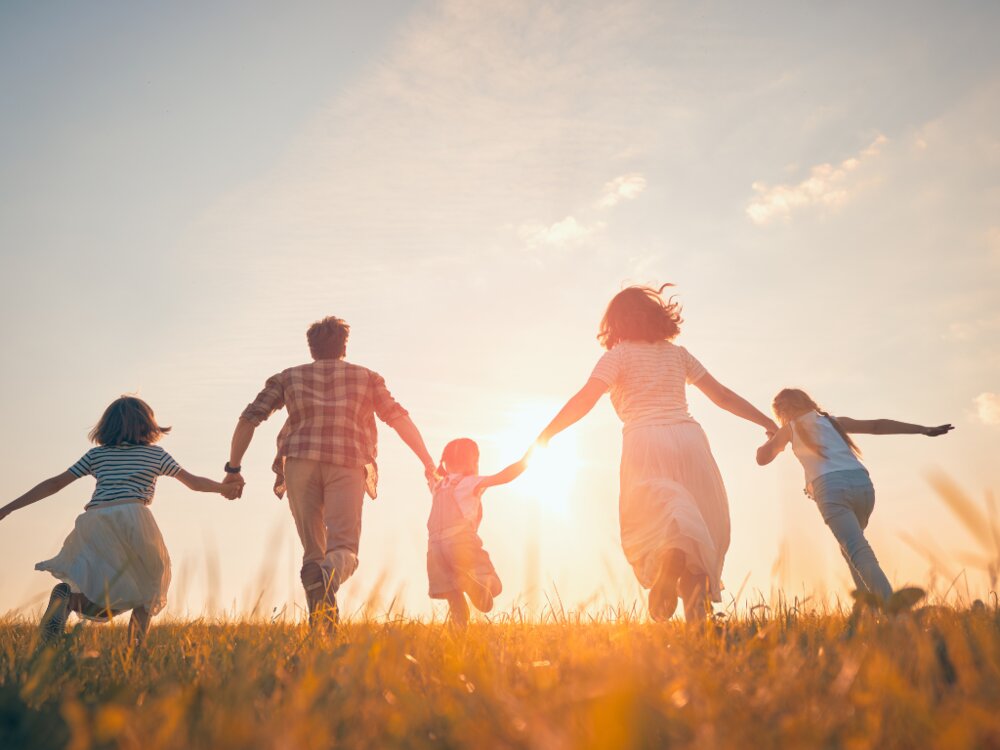 Family running through field