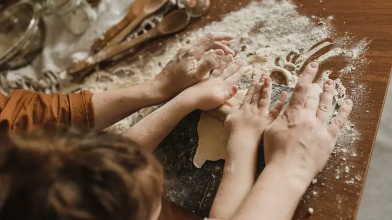 Parent and child baking together