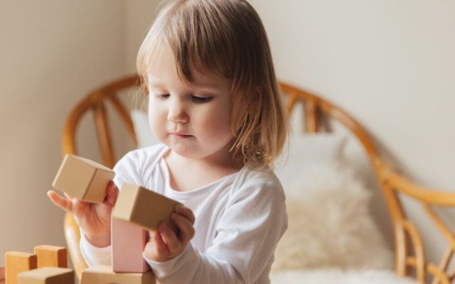 Toddler playing with blocks