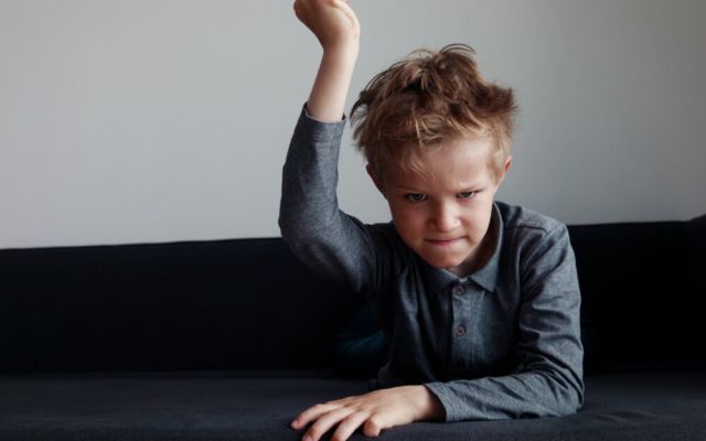 Angry child slamming table