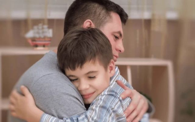 Father and son hugging