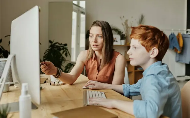 Mum and son on laptop