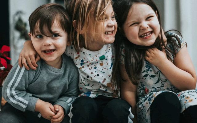 Three laughing kids
