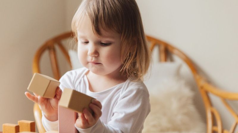 Toddler playing with blocks