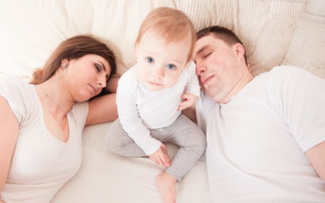 Young family in bed