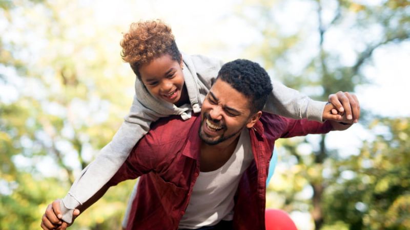 Dad and son laughing