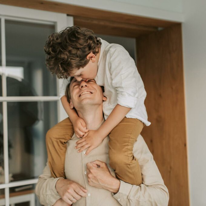 Father giving his son a piggy-back ride